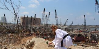 Taekwondo practitioner condoles at the explosion site